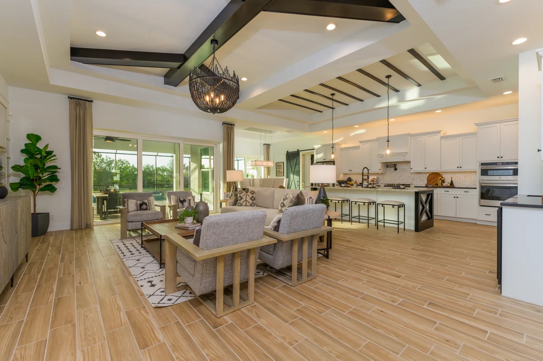 The Destin model home by Sam Rodgers Homes — great room open to the kitchen