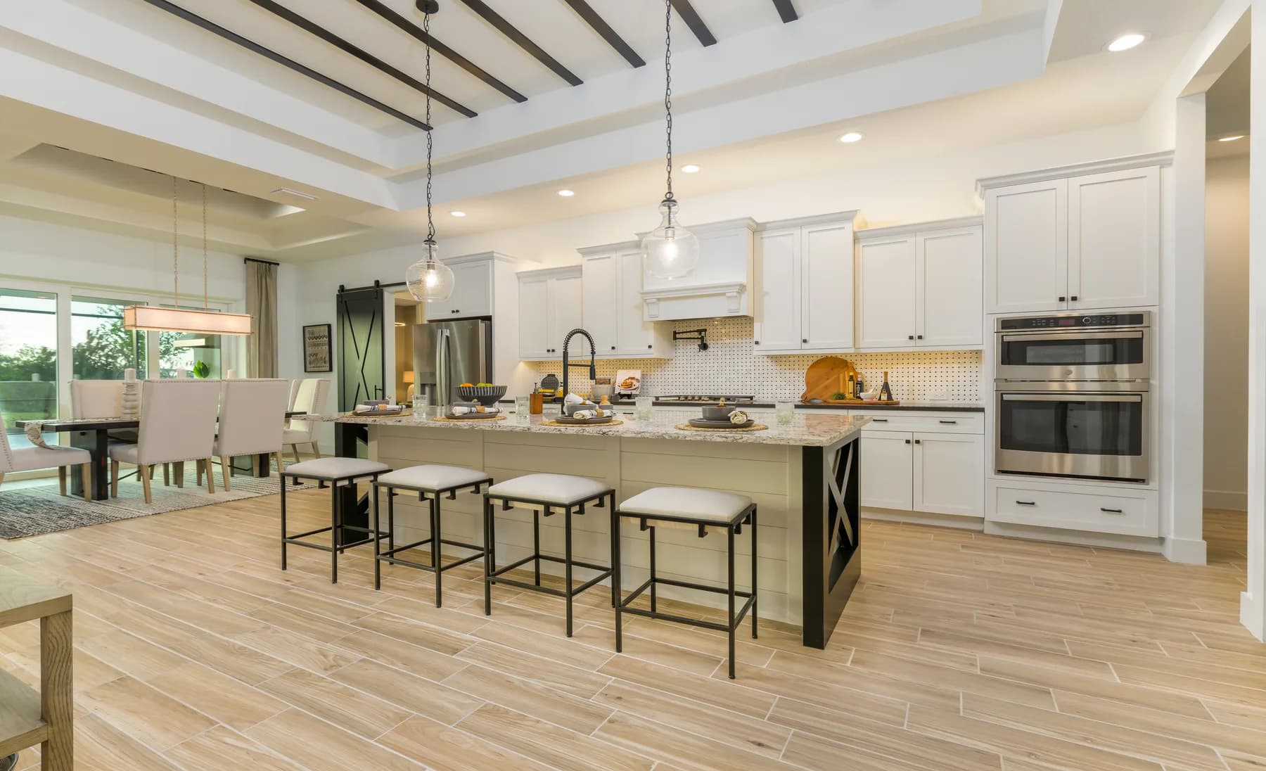 The Destin model home by Sam Rodgers Homes — kitchen island with seating