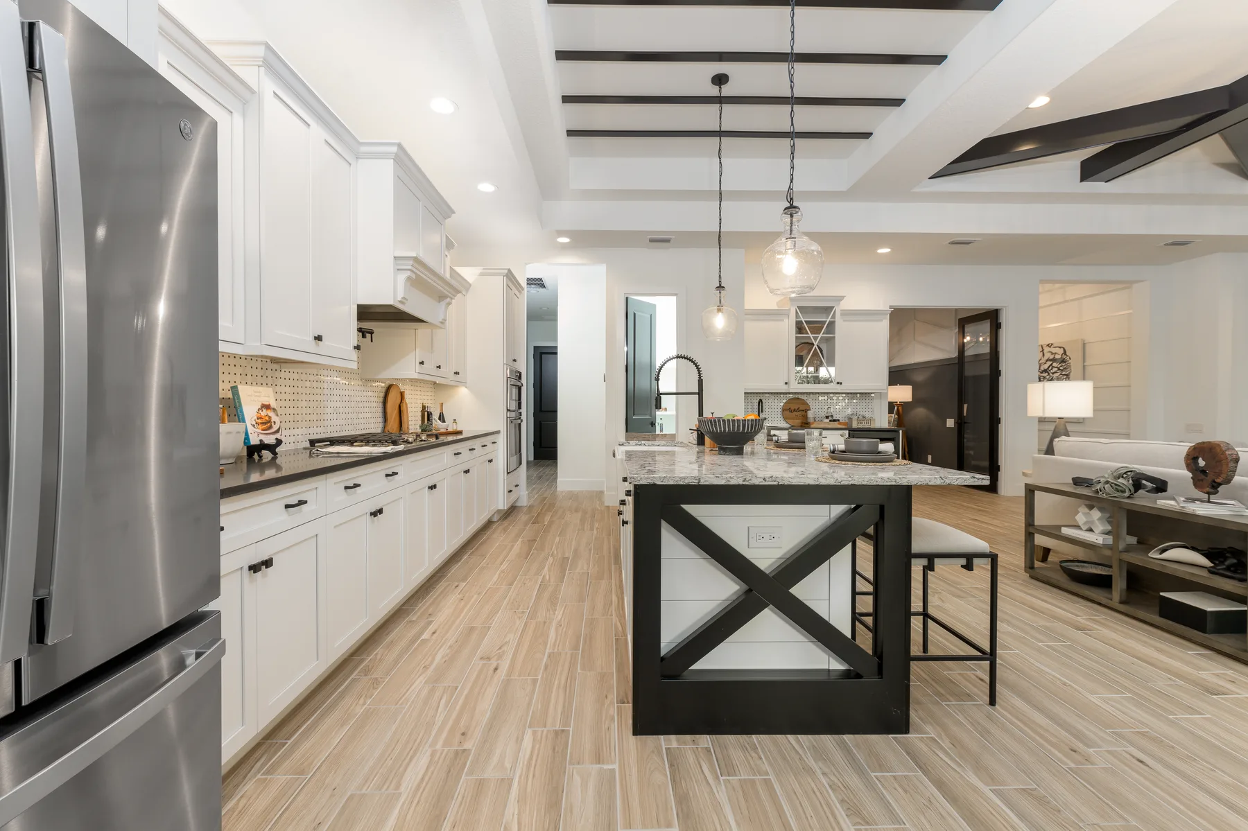 The Destin model home by Sam Rodgers Homes — kitchen with built-in stainless appliances