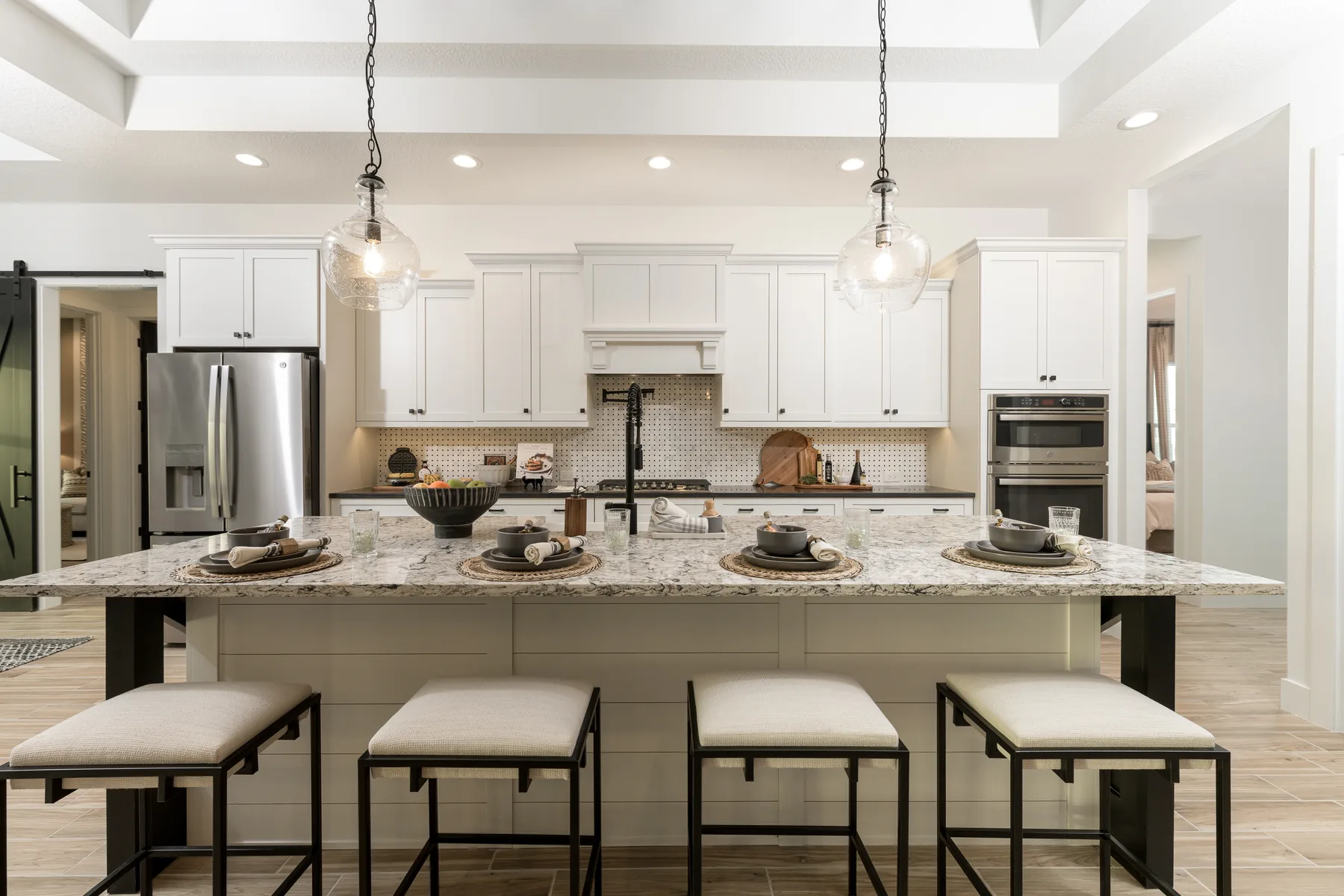 The Destin model home by Sam Rodgers Homes — kitchen island bar seating