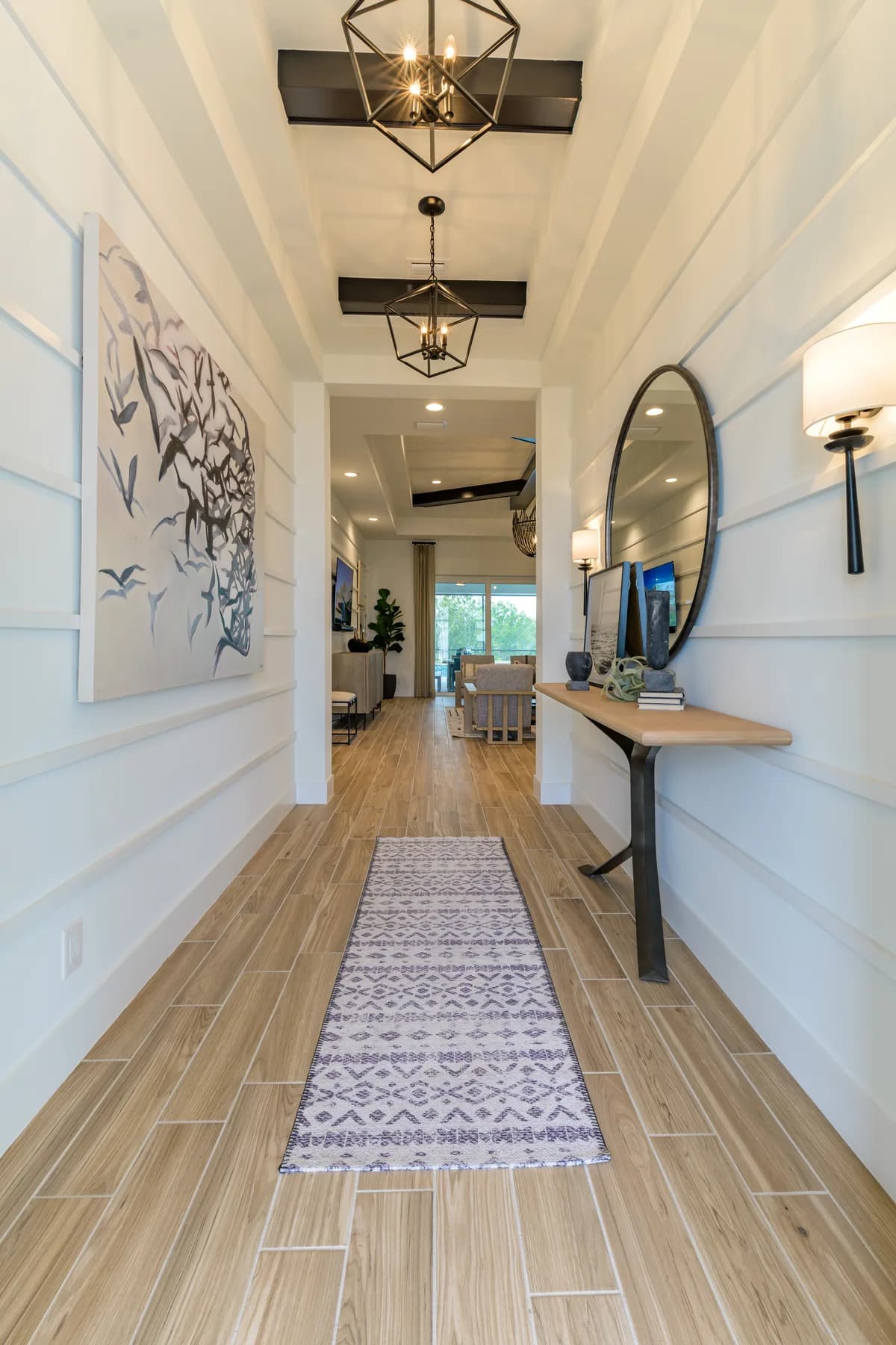 The Destin model home by Sam Rodgers Homes — entry hall with console and mirror