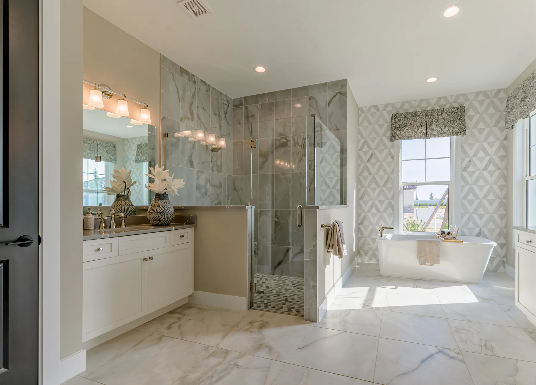The Destin model home by Sam Rodgers Homes — owner's bath with double vanity