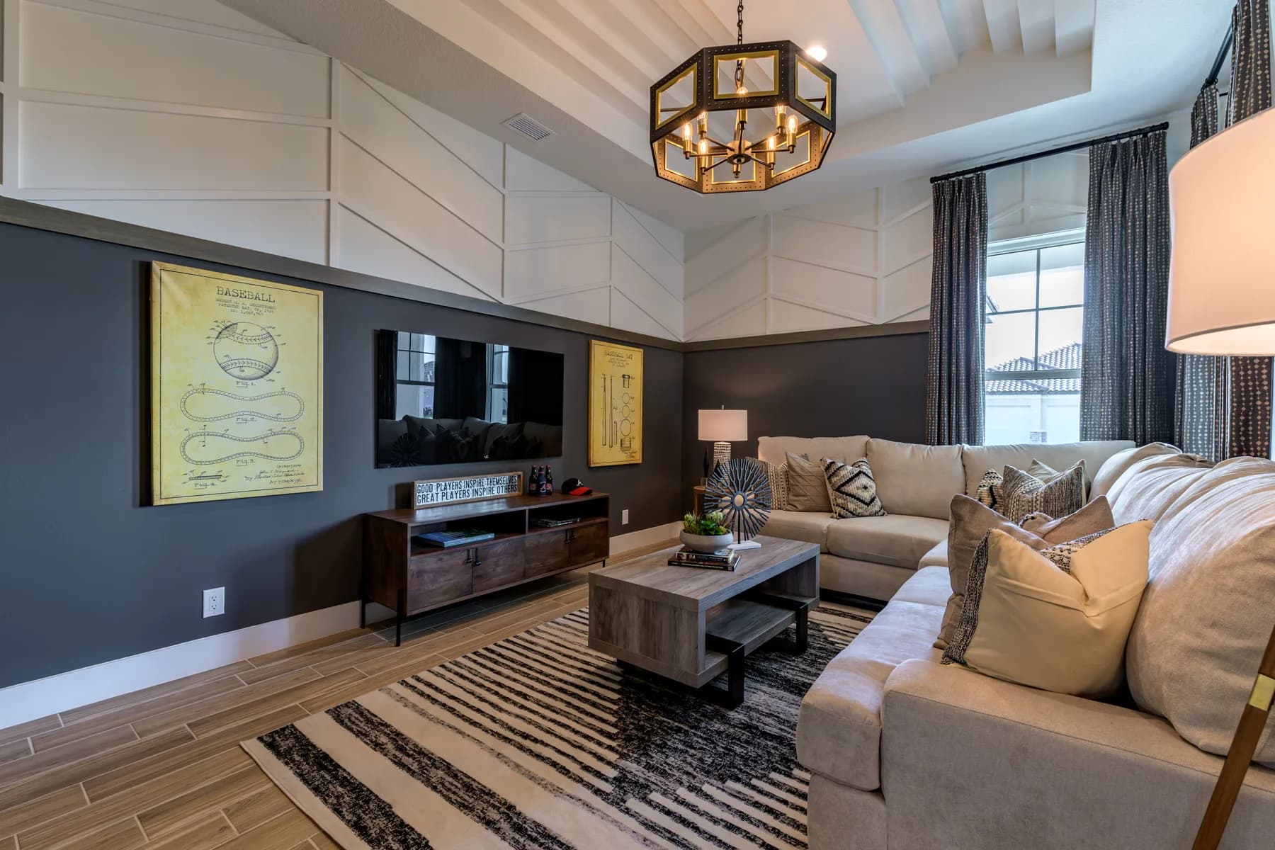The Destin model home by Sam Rodgers Homes — den with dark accent wall