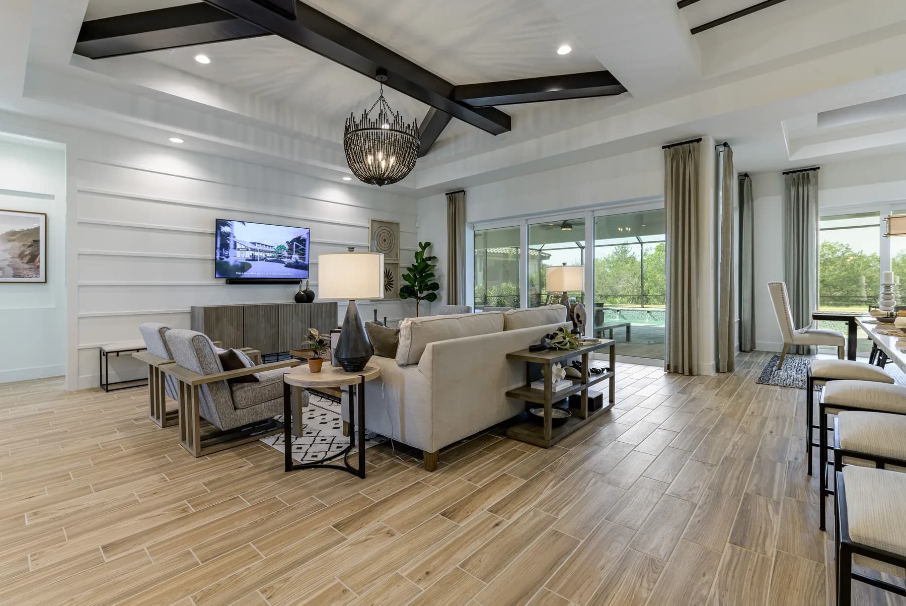 The great room of the Destin model, with exposed wood beams