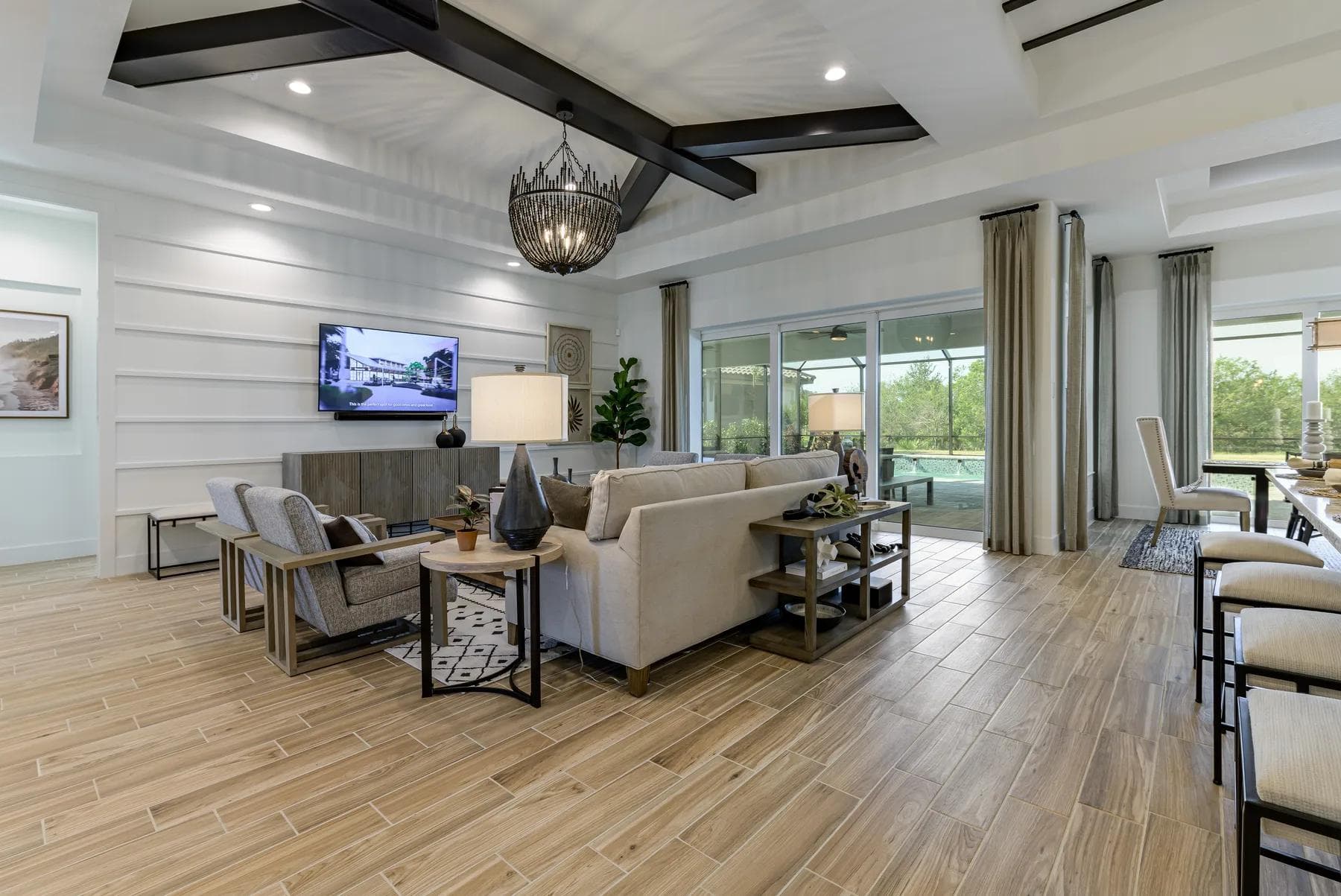 The great room of the Destin model, with exposed wood beams