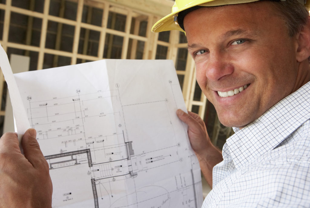 Construction worker viewing image of home layout